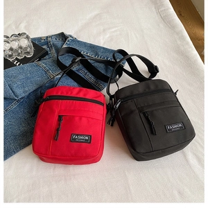 Vertical nylon crossbody mini bags in black and red with adjustable shoulder straps