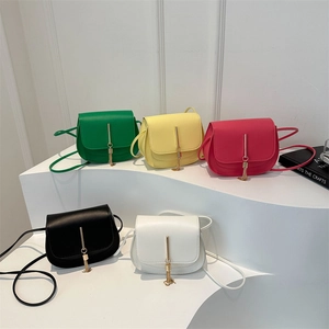 Minimalist square crossbody bags with tassel charms shown in five elegant colors
