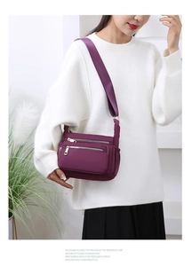 Deep purple nylon crossbody bag with multiple zip pockets and adjustable strap for women