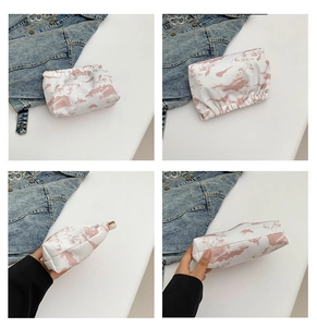 Detail view of the floral pattern and soft nylon fabric on this Chinese style pouch