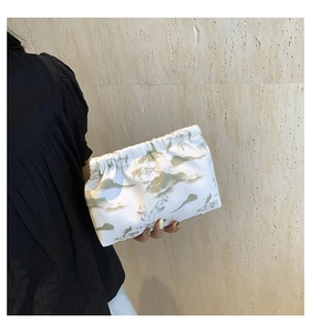 Detail of nylon bag with Chinese landscape art showing elegant green scenery and bird print