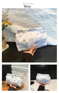 Detail of blue Chinese landscape painting on nylon bag with drawstring closure