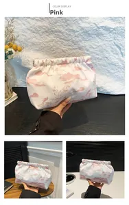 Detail of white nylon tote bag with pink Chinese landscape print and ruched design