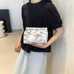 Minimalist nylon tote bag with traditional Chinese landscape print and pleated opening