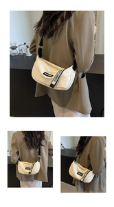 Détails du cuir grainé beige et de la bandoulière tissée avec lettrage tendance