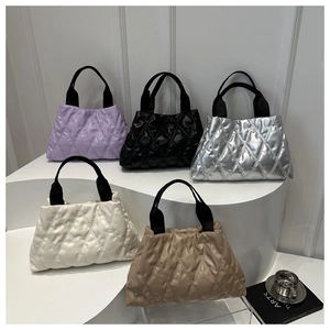 Detailed display of quilted tote bags in purple, black, silver, white and khaki colors
