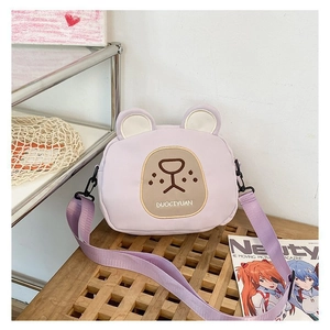 Close-up of cute purple bear canvas crossbody bag with 3D ears and durable metal strap hooks