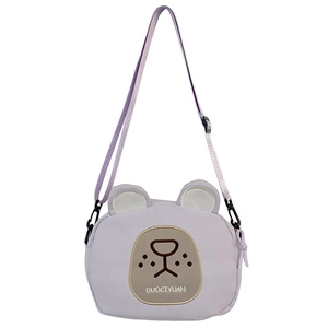 Detail view of purple cartoon bear canvas bag with adjustable strap and bear embroidery