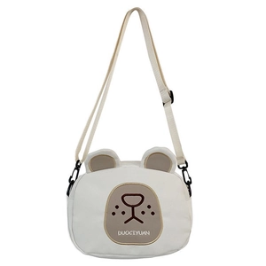 Cute cartoon bear canvas crossbody bag for kids featuring 3D ears and adjustable strap