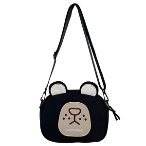 Detail of cute black bear canvas crossbody bag with adjustable strap and embroidery