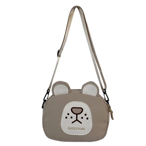 Detail of cute bear crossbody bag with khaki canvas texture and adjustable strap