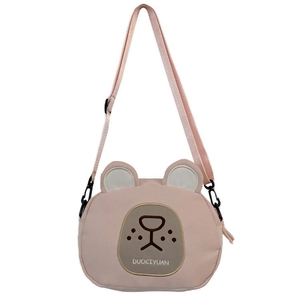 Detail of cute pink bear canvas crossbody bag showing texture and adjustable strap
