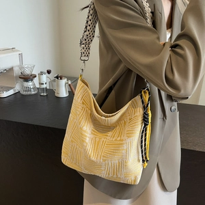 Large striped canvas crossbody bag with floral strap and casual hobo style for women