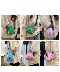 Detail view of colorful shell-shaped canvas bags in green, purple, blue and pink