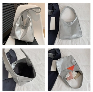 Detail view of silver hobo bag with geometric embossing and spacious inner lining