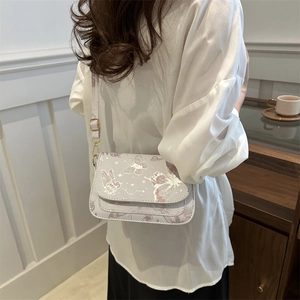 Elegant white crossbody flap bag with butterfly pattern and chain strap for women