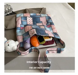 Detailed interior of a patchwork plaid tote bag showing its large storage capacity
