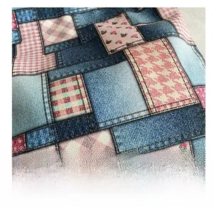 Detailed view of patchwork fabric with denim, pink plaid, and houndstooth patterns