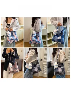 Close-up of patchwork tote bags with denim textures and cute bunny plush charms