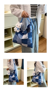 Detailed view of color-block denim tote bag with cute white rabbit plush keychain
