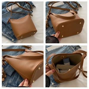 Vues détaillées du sac seau marron avec grain de cuir, capacité et clous de protection