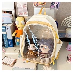 Detail of the clear PVC display window on a white and yellow canvas ita bag for plushies