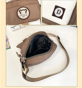 Detailed interior of the brown canvas messenger bag with internal pocket and sturdy zipper