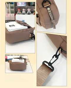 Detail view of brown nylon crossbody bag showing side pockets for umbrella and water cup