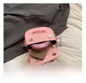 Interior view showing the capacity of the pink leather saddle bag for phone and wallet