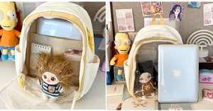Detail view of white and yellow school backpack with clear PVC window and spacious interior