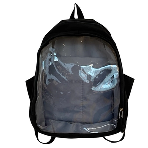 Detailed view of black nylon backpack featuring a clear PVC window pocket for doll display