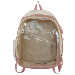 Detail view of the pink and beige ita bag showing a large transparent PVC display pocket