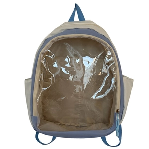 Front detail of a light blue and beige Ita bag with a large transparent PVC pocket