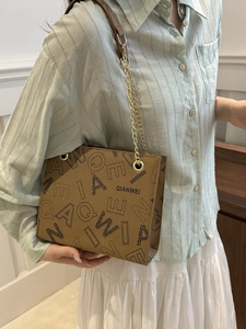 Brown leather shoulder bag with QIANWEI letter print and gold chain strap for women
