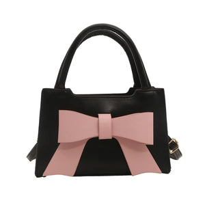 Retro black leather handbag with a large pink bow, versatile crossbody and top-handle style