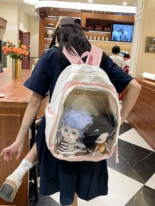 Pink and white casual backpack for women featuring a clear PVC window with plush dolls