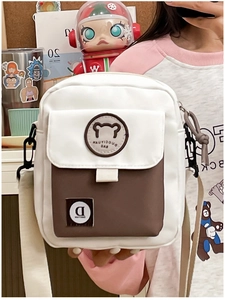 Detail of cute bear embroidery on a small Korean style canvas crossbody bag for women