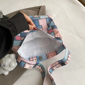 Patchwork tote bag with plaid and floral patterns, featuring spacious interior and magnetic snap
