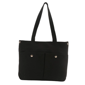 Black canvas tote bag for women featuring double front pockets with silver metal snaps
