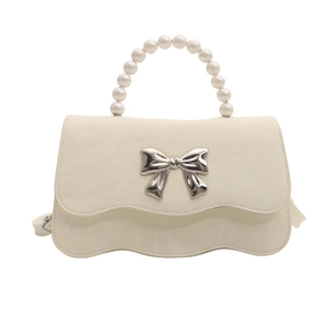 Fashionable creamy white small square bag with pearl handle and silver metal bow decoration