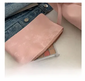 Pink mini PU leather tote bag charm with zipper for small makeup items macro detail