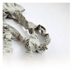 Detail of comfortable ruched shoulder strap in sage green on a large tote bag