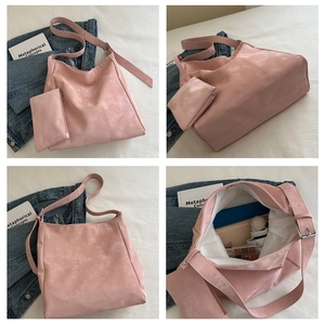 Detail view of retro pink hobo tote bag showing spacious interior and small matching pouch