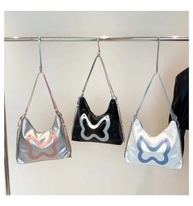 Three metallic bow tote bags in silver-pink, black-silver and white-blue color options