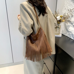 Vintage large capacity brown leather tote bag with long tassels and gold metal hardware