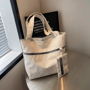 Minimalist white large capacity tote bag with pleated texture and matching zipper pouch