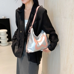 Silver bow tote bag with pink butterfly detail and metallic studs for trendy women
