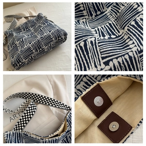 Close-up of geometric jacquard fabric and polka dot strap on the large canvas tote bag