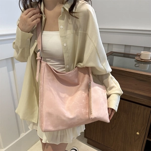 Pink minimalist faux leather hobo tote bag with matching pouch and wide adjustable strap
