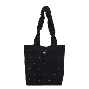 Minimalist black pleated tote bag with silver metal studs and drawstring closure